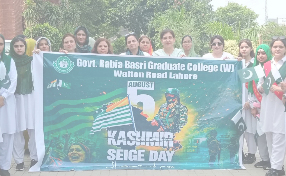 Students holding an event banner